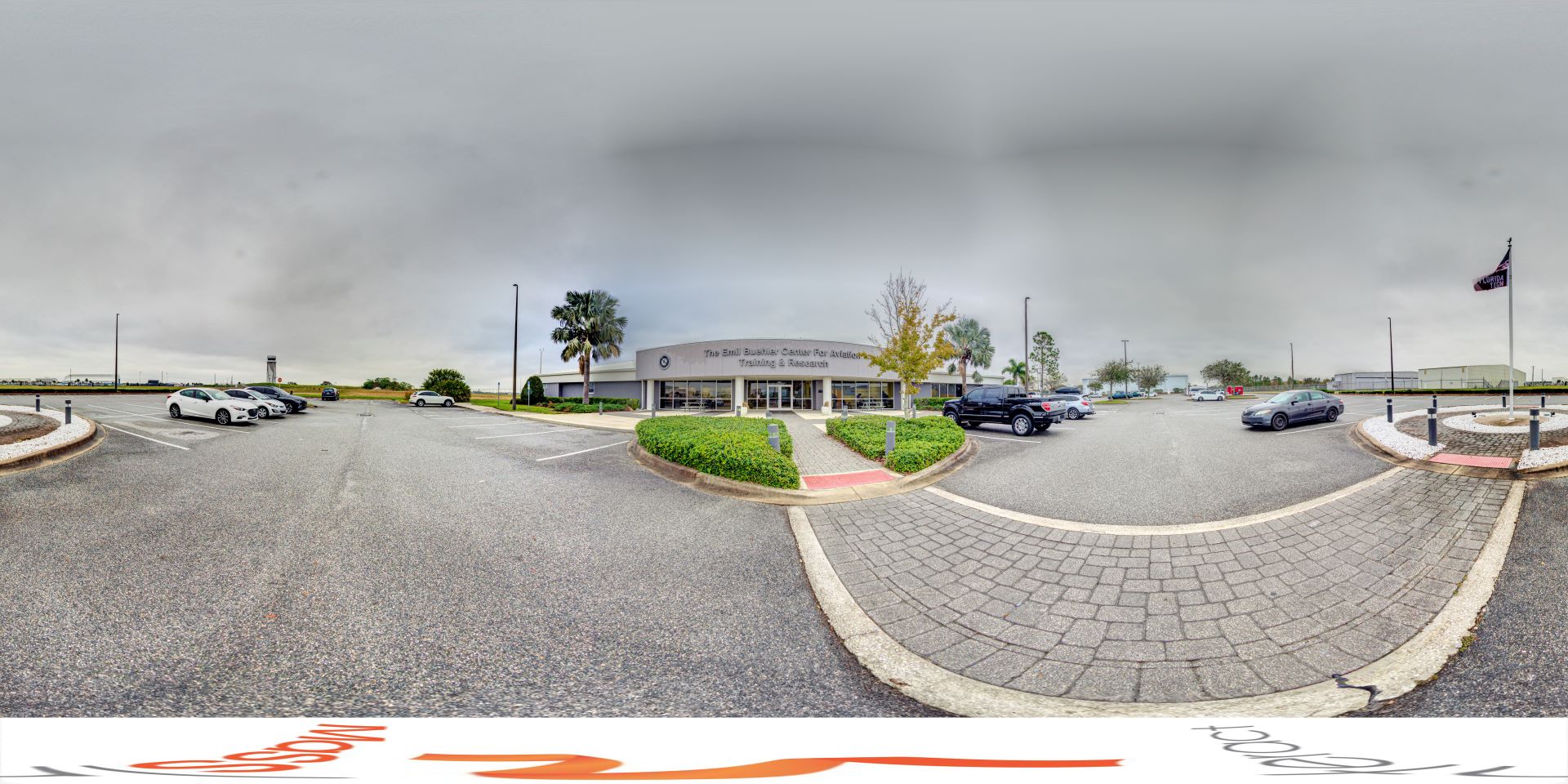 The Emil Buehler Center for Aviation Training & Research with parking lot in front